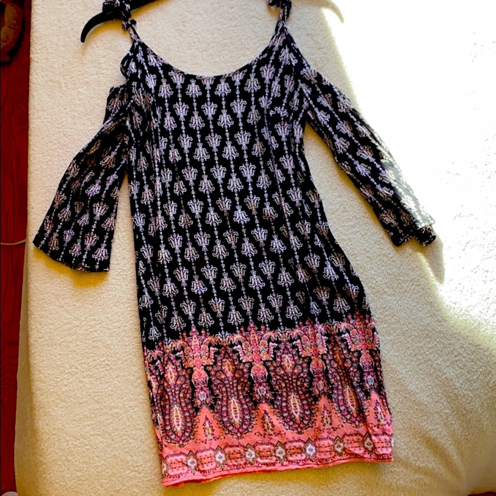 A black, pink, and white pattern dress